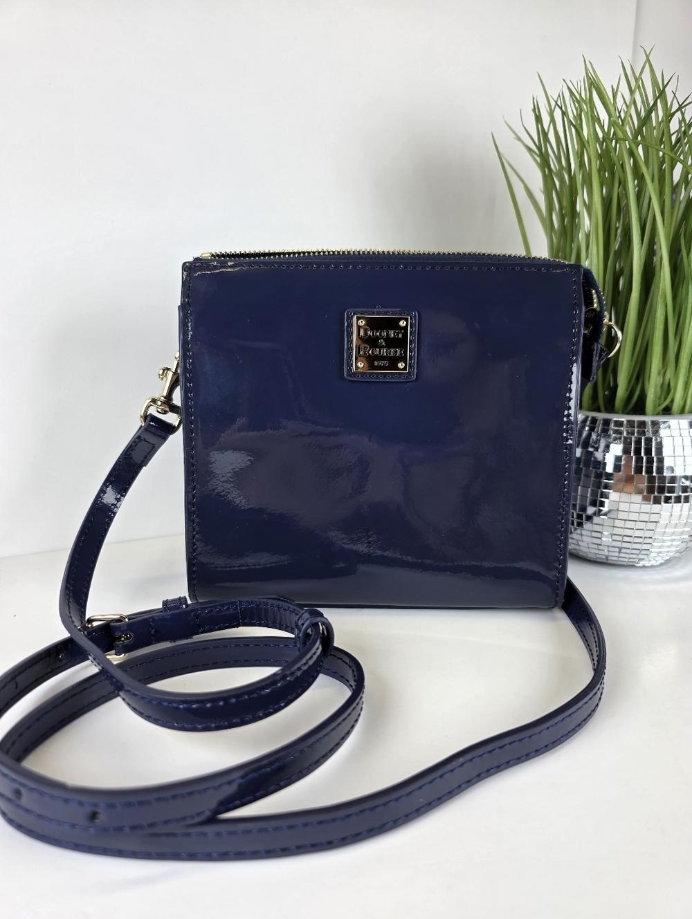 Dooney & Bourke Patent Navy Crossbody with Gold Logo Plaque